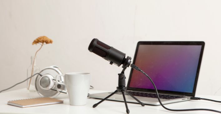 Microphone, laptop and headphones