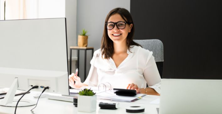 Smiling woman working at a computer